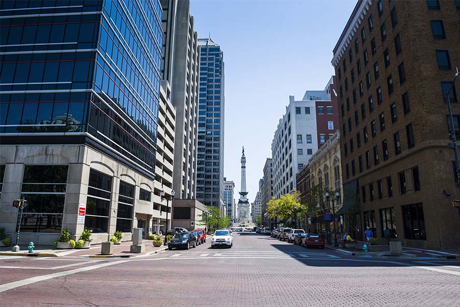 Contact - View of a Main Street in Downtown Indianapolis Indiana Surrounded by Commercial Buildings